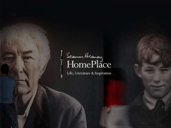 Portrait of Seamus Heaney old and young printed on wall.